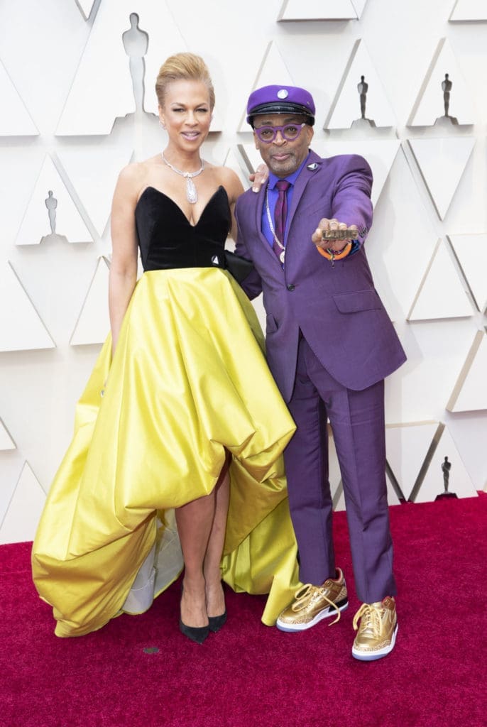 Tonya Lewis Lee wore a Bibhu Mohapatra gown with black velvet bustier and yellow skirt with high-low hemline to the Oscars with husband Spike Lee. (ABC/Rick Rowell)
 