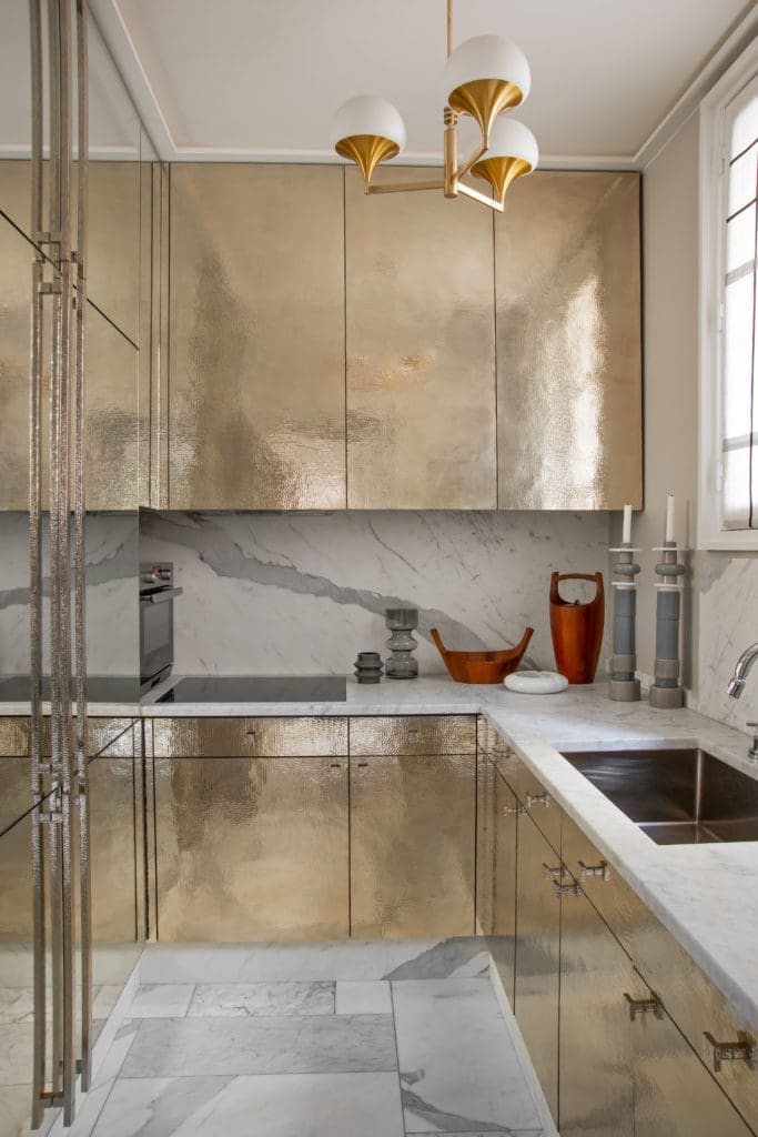 Custom-made cabinets of hammered silver with matching handles, designed by Jean-Louis Deniot.