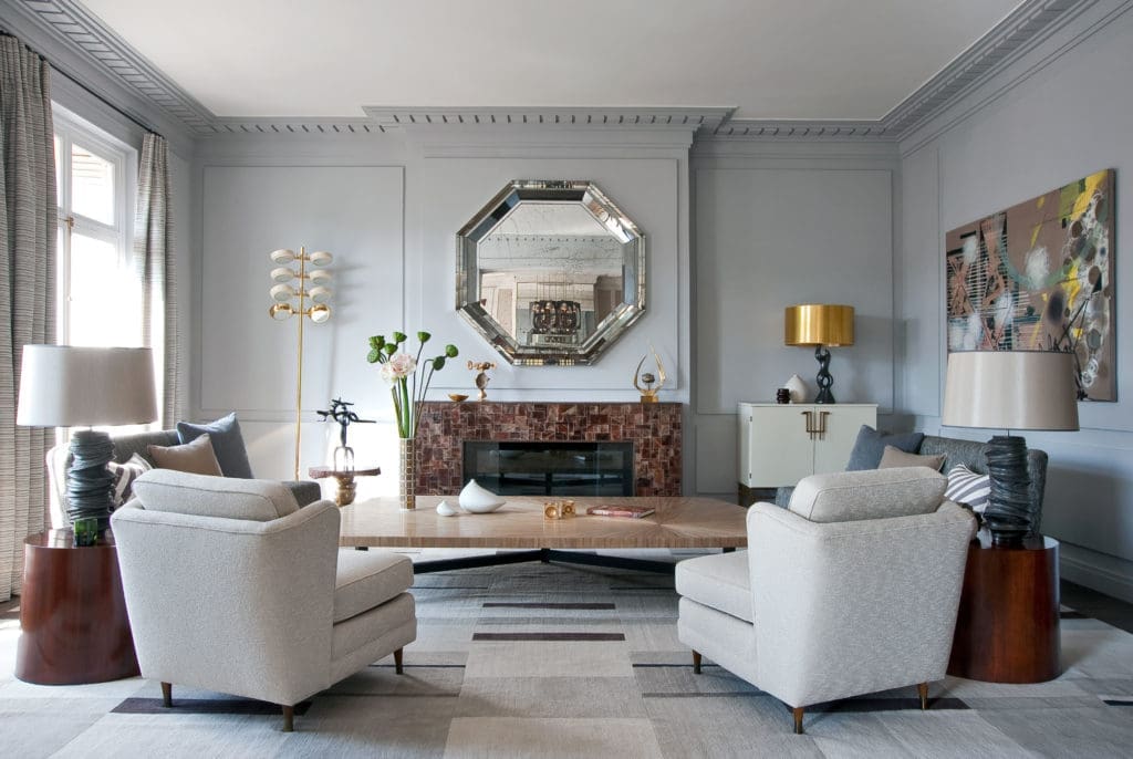 n an apartment on Avenue d'Eylau in Paris, straw marquetry coffee table by Lison de Caunes, designed by Deniot;  cubist custom carpet by Galerie Diurne designed by Deniot.