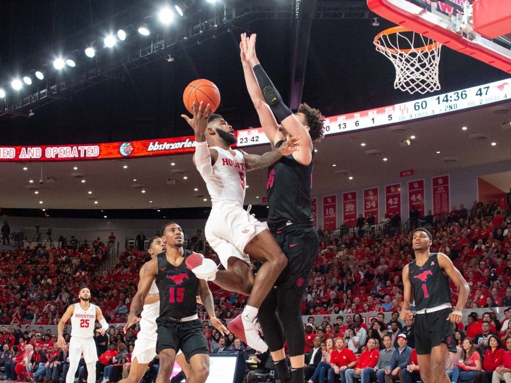 University of Houston guard Corey Davis Jr. is fearless driving to the hoop. (Photo by F. Carter Smith)