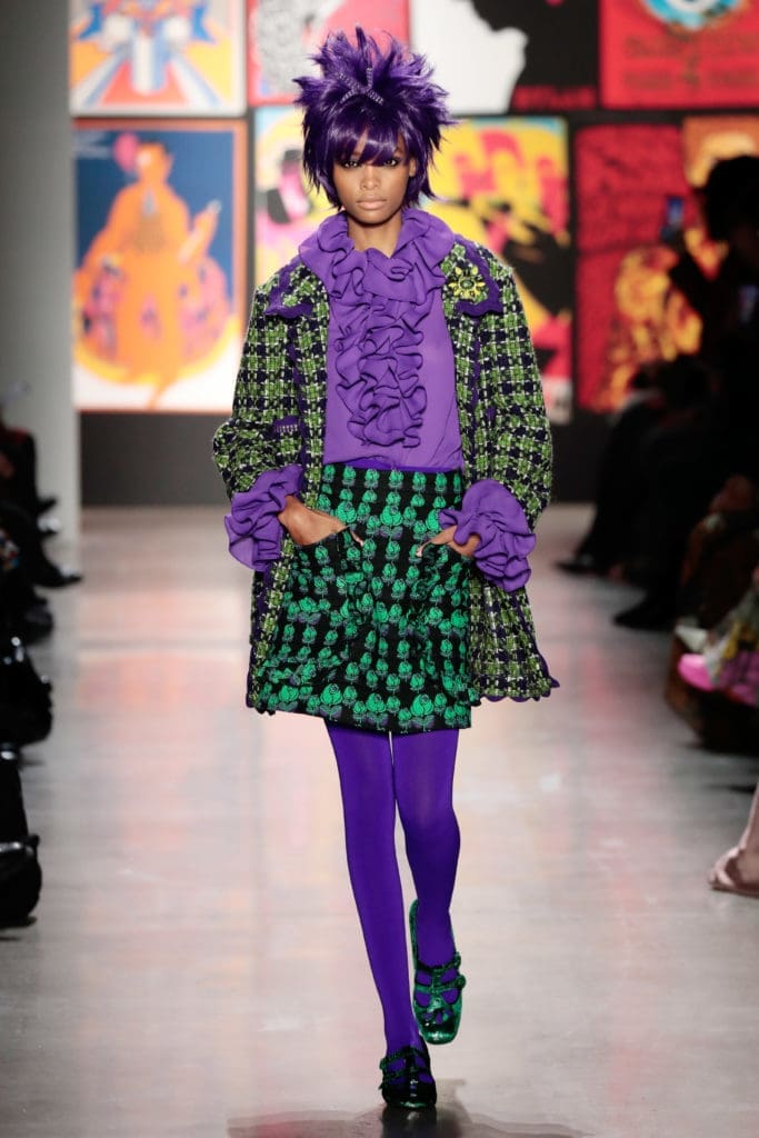 Anna Sui purple and green tweed coat, purple ruffled blouse, checked mini-skirt with pockets. (Photo by Anna Sui)