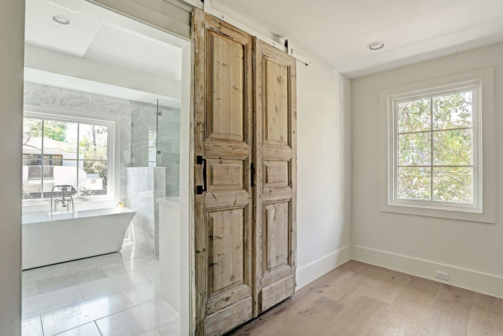 A sitting area off the master leads to the bath.