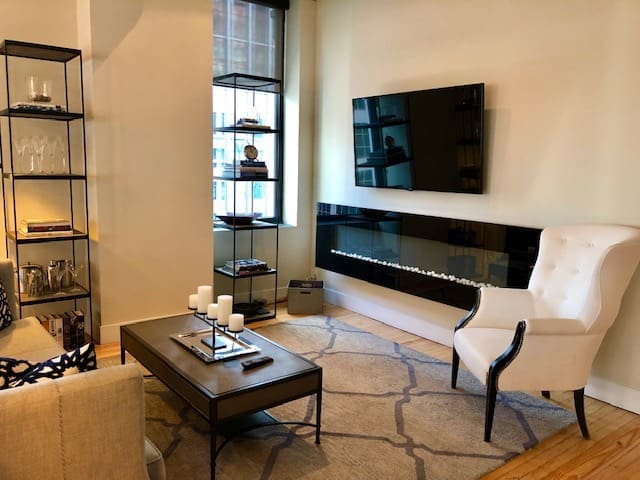 A vertical fireplace adds glamour to this St. Germain reidence.