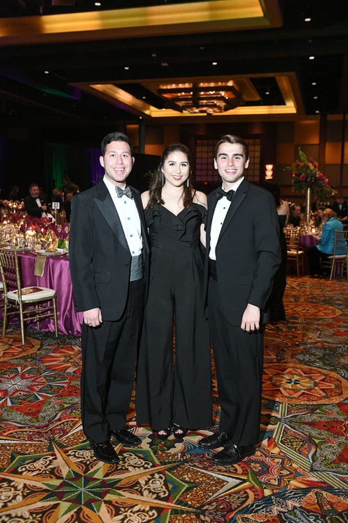 Ryan & Rebecca Reza, Thomas Forster at the University of St. Thomas Mardi Gras ball.