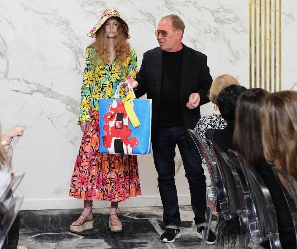 At Saks Fifth Avenue Michael Kors showcases his collection of hand-painted totes for summer outings. (Photo by Daniel Ortiz)