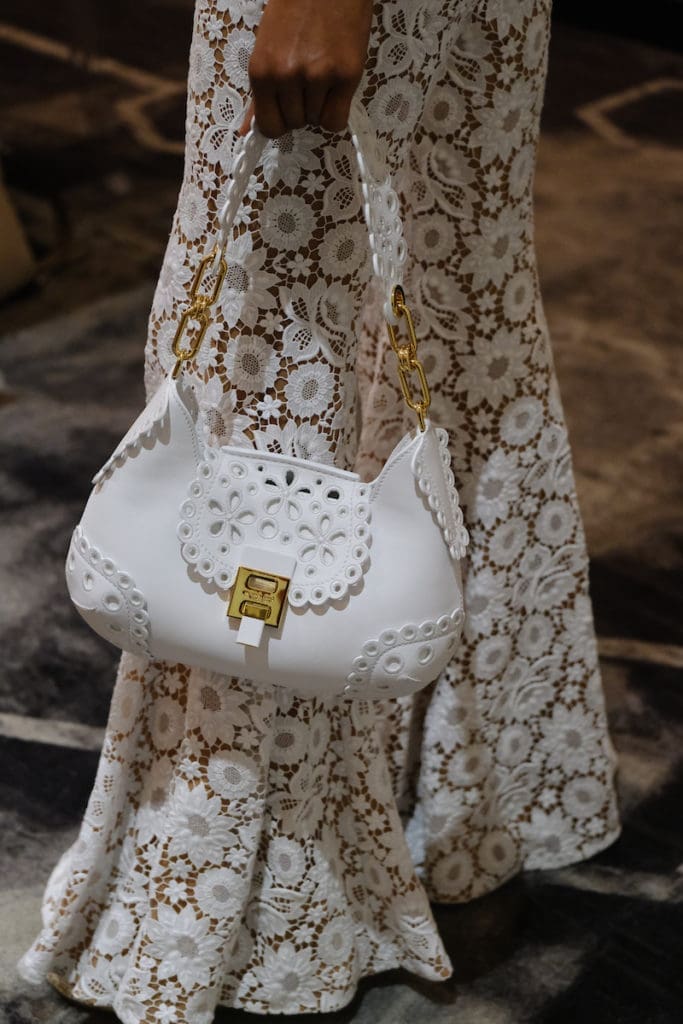 A Michael Kors good idea starts with a dress and includes a stunning handbag. (Photo by Daniel Ortiz)