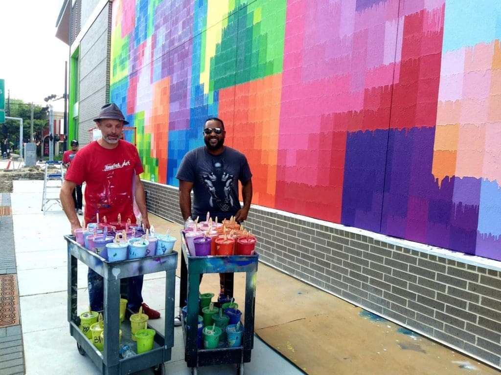 Mr. D and filmmaker Neiman Catley on the final day of wrapping "Pearl Paint Wall" (Photo by the author) 