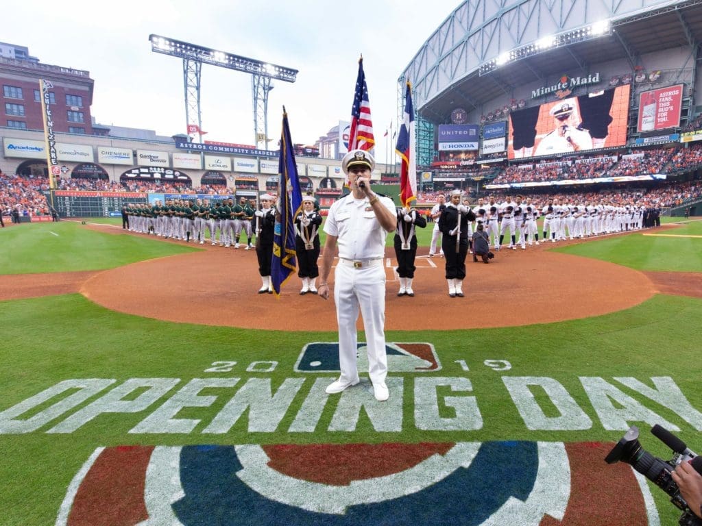 Navy Lieutenant Commander (and former Texas A&M grad) Greg Sharp sang the National Anthem at the Houston Astros' home opener. (Photo by F. Carter Smith)