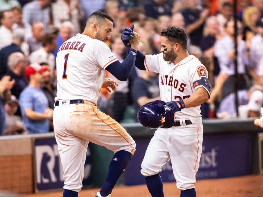 Carlos Correa and Jose Altuve celebrated another big Astros moment. (Photo by F. Carter Smith)