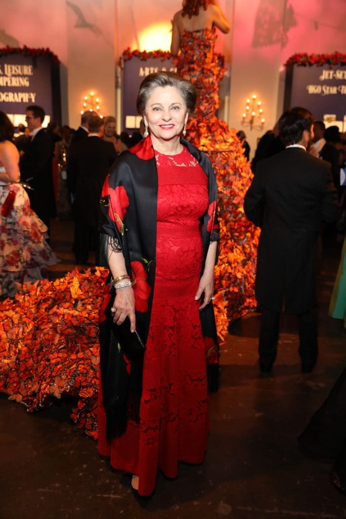 Beth Madison wore a red Carolina Herrera gown with black-and-red full-length coat to the Houston Grand Opera Ball. (Photo by Priscilla Dickson)