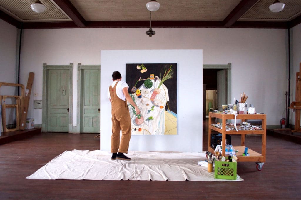 Bradley Kerl painting in the third-floor studio at 100W, Corsicana, Texas (Photo by Kyle Hobratschk)