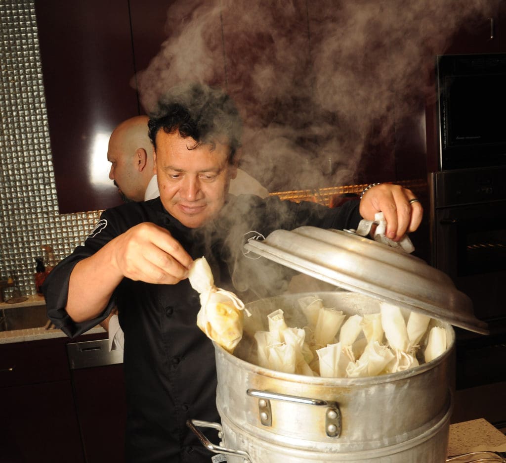 Hugo Ortega cooks for the KNOWAutism dinner in a private home. (Photo by Dave Rossman)