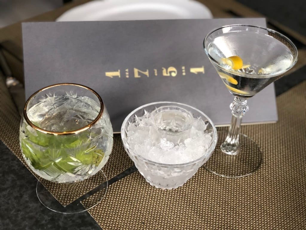 The Clearwater cocktail and the Gin Act martini are among the hundreds of cocktail possibilities at 1751 Sea and Bar. The small glass in the center is the other half of the martini, chilled to perfection. (Photo by Shelby Hodge)