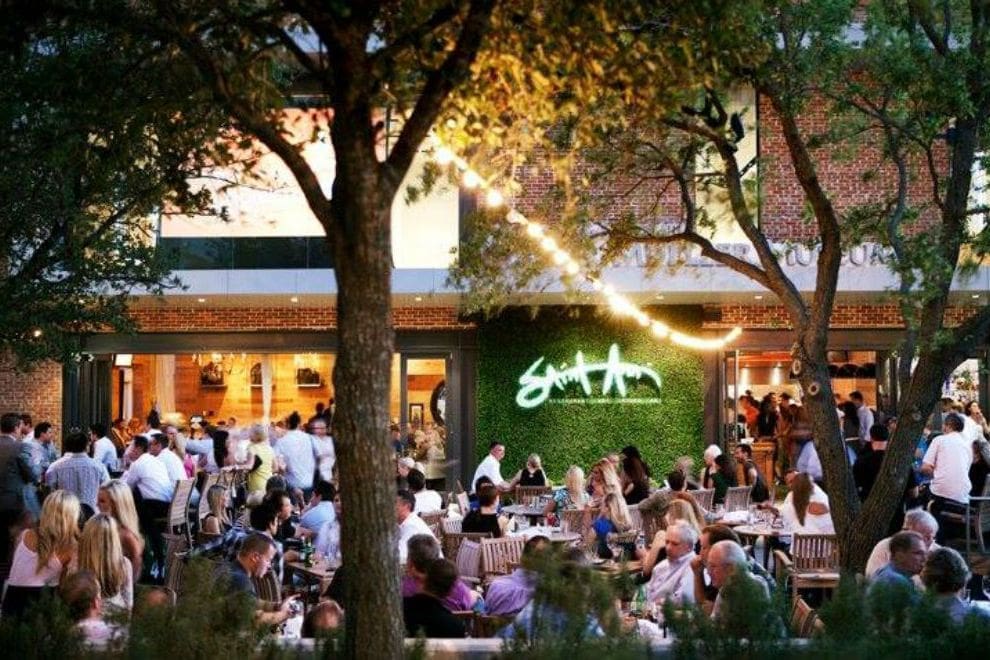 Saint Ann Dallas’ beautiful patio adjacent it’s historic building.