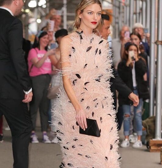 Model Martha Hunt wore a Jason Wu feather dress to the Time 100 Gala. The next day Wu hand-carried the dress to Houston for a runway show at the Children's Assessment Center luncheon.  (Instagram: @JasonWu)
