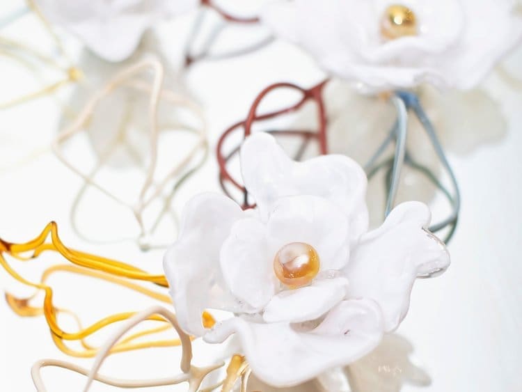 Anna Curnes creates glass art, such as flowers and murals.  (Photo by Sara Kerens)