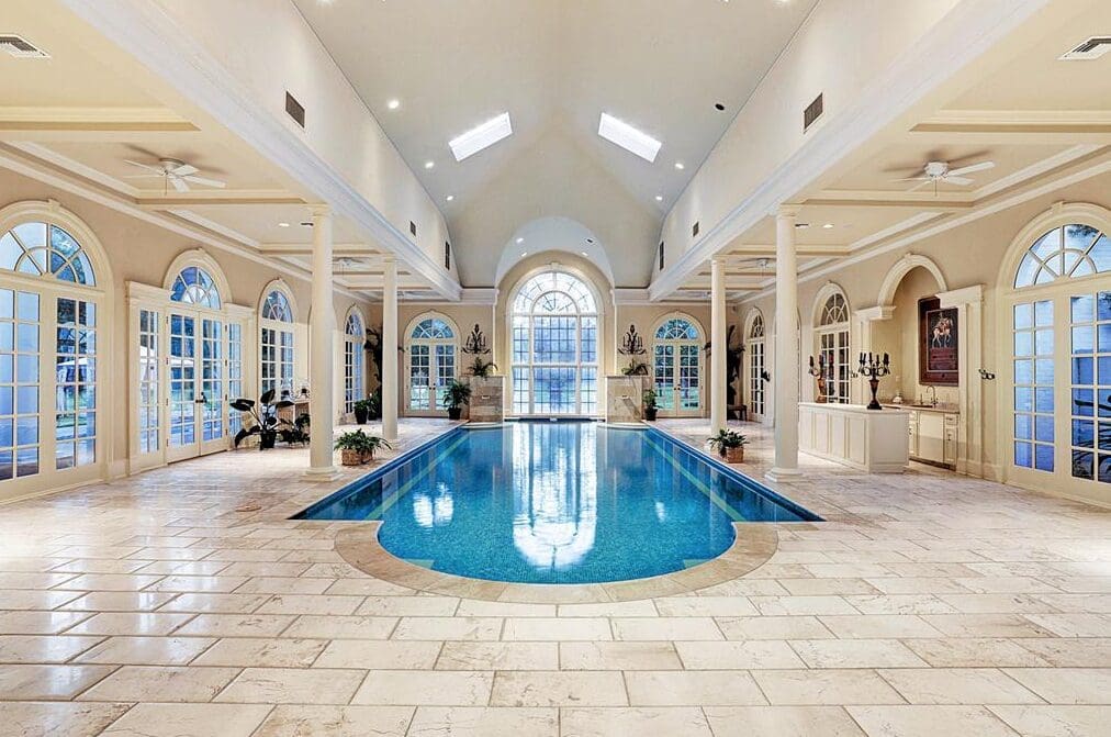 Reminiscent of a grand hotel spa pool in Paris, this pool is just the start of the water play at this 14,000 square foot French Colonial home in Rivercrest, listed with John Daugherty Realtors.