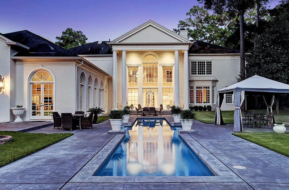 This 14,000 square foot French Colonial home in Rivercrest is one of the many that were listed with John Daugherty Realtors.