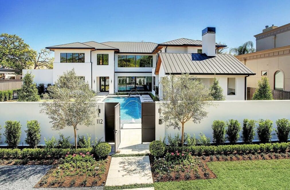 The swimming pool serves as a welcoming water feature at 112 Glenwood new construction home from Allan Edwards.