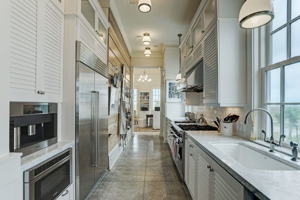 The galley-style kitchen in this Beachtown residence is a home cook's dream. (Photo by TK Images)