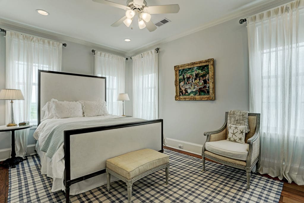One of four bedrooms, complete with full baths, make this Beachtown home great for entertaining. (Photo by TK Images)
