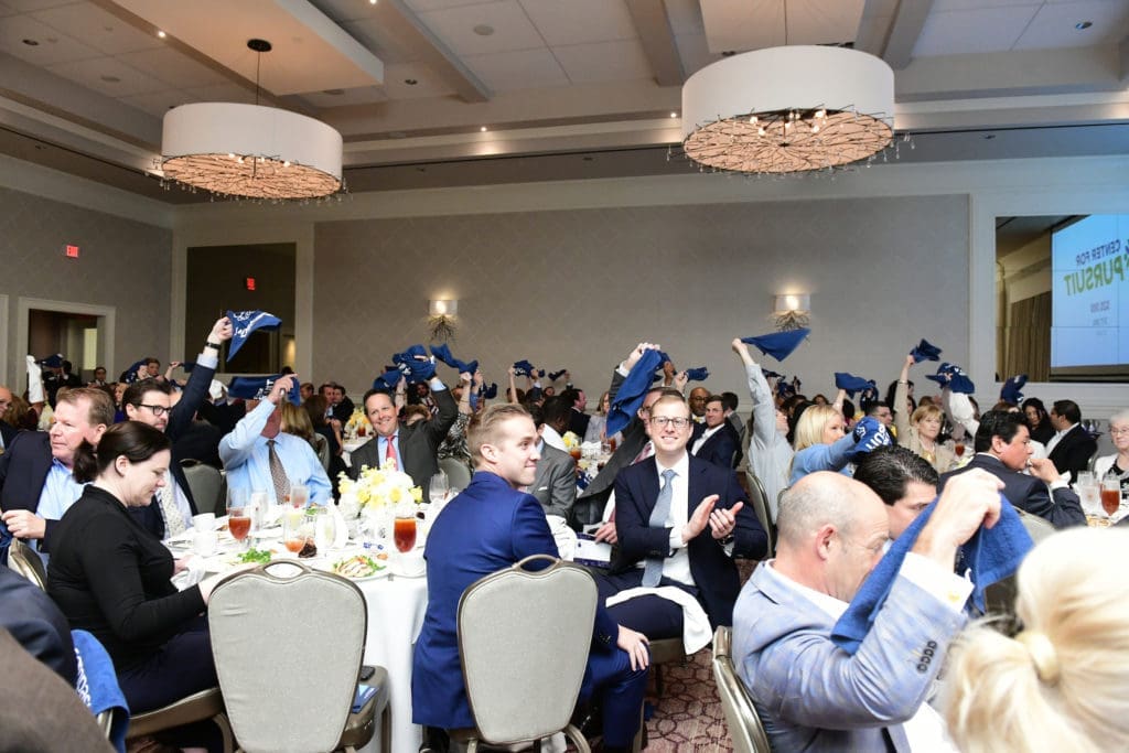 Rally towels on high at the Center for Pursuit luncheon. (Photo by Daniel Ortiz)