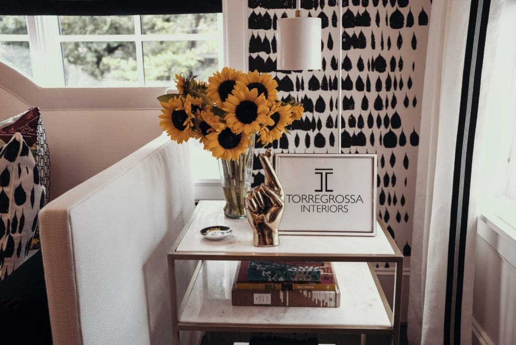 Fresh cut sunflowers on marble living room table at ASID Show House Preview