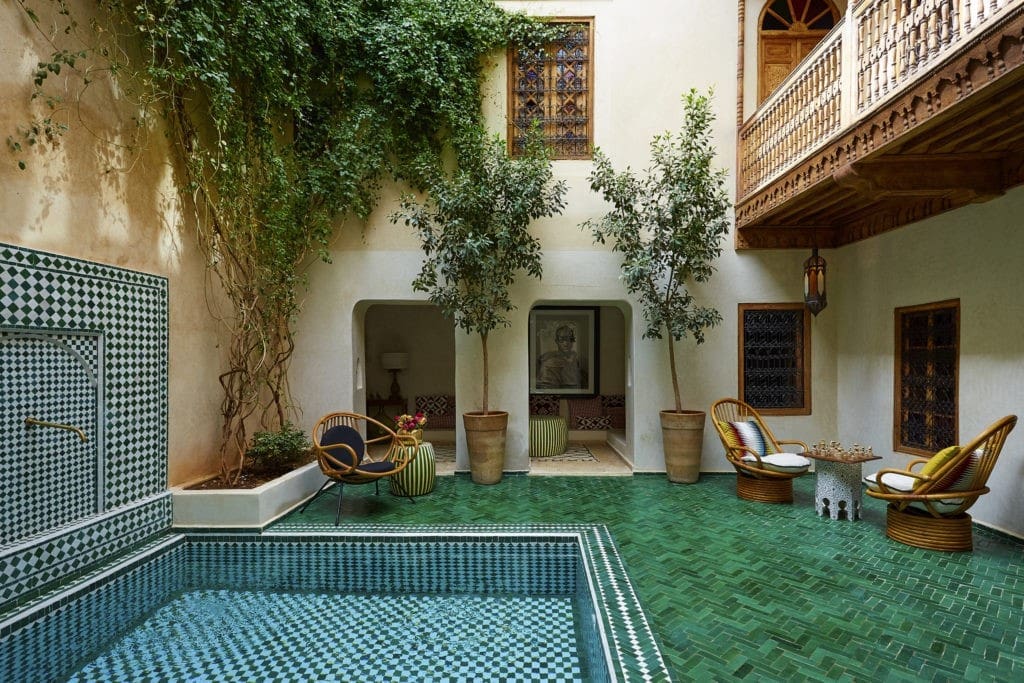 Enclosed courtyards, swimming pools, palm trees, hidden stairways, and romantic balconies give the hotel a special intimacy. (Photo by Kasia Gatkowska)