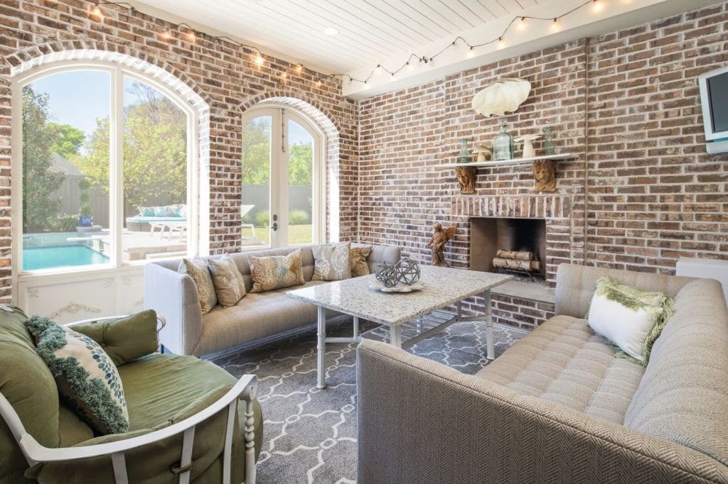 The screened-in porch has its own fireplace and television wiring. 