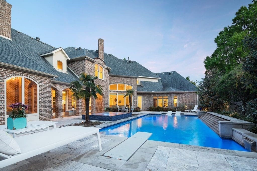 The oversized pool features an infinity spa. 