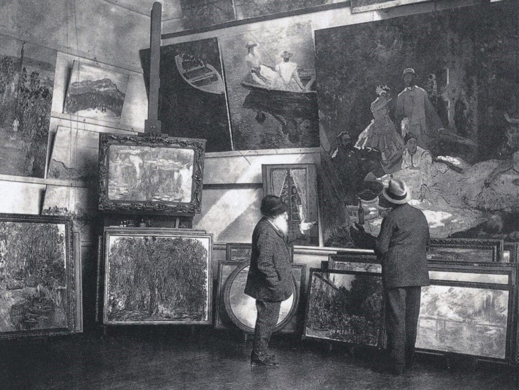 Claude Monet in his second studio in Giverny with the Duc de Trevise, 1920