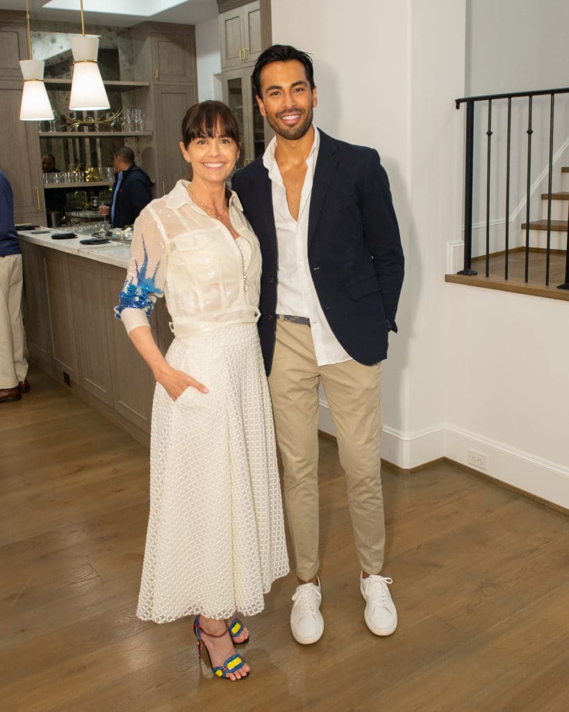 Marnie Greenwood, Krish Arora at the Tupper Lake open house saluting Compass.