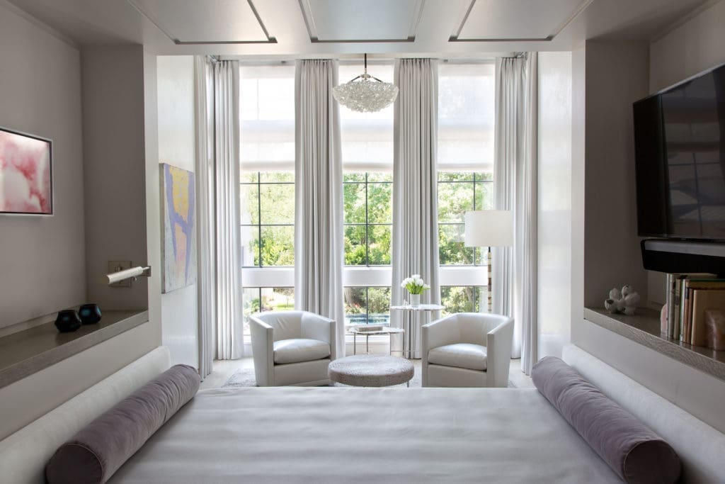 The bedroom in the guest house features a built-in bed, designed by Paul Duesing and Joseph Minton, divides the room. (Photo by Emily Minton Redfield)