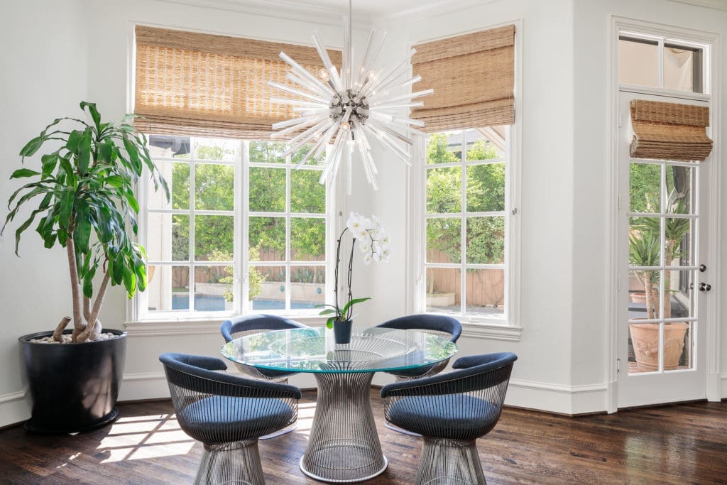 A breakfast area has great views of the outdoor oasis. 