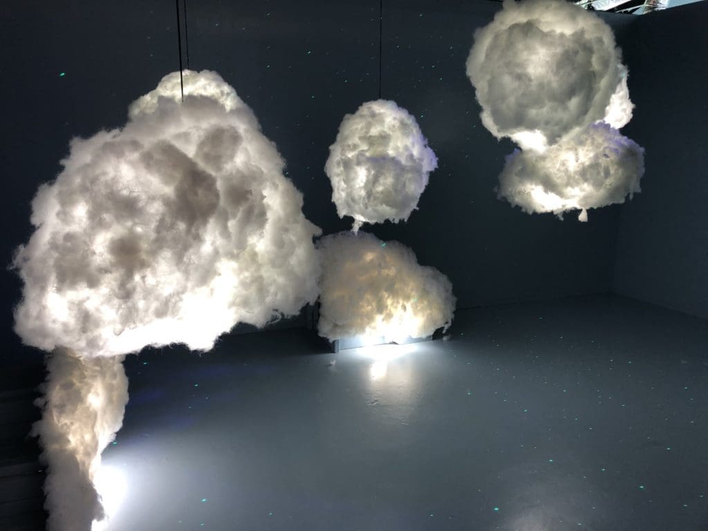 Pose in the clouds at the art installation. (Photo by Megan Ziots)
