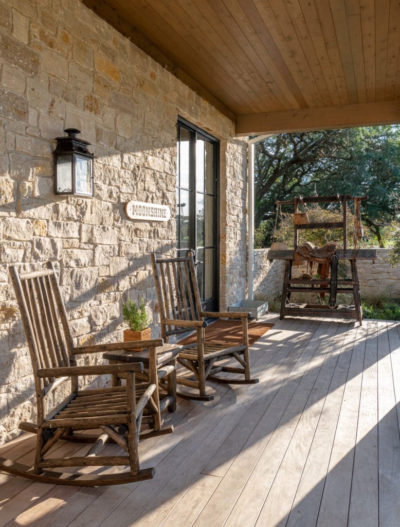 Rustic rocking chairs beckon guests to the shaded porches.  (Photo by Michael Hunter)