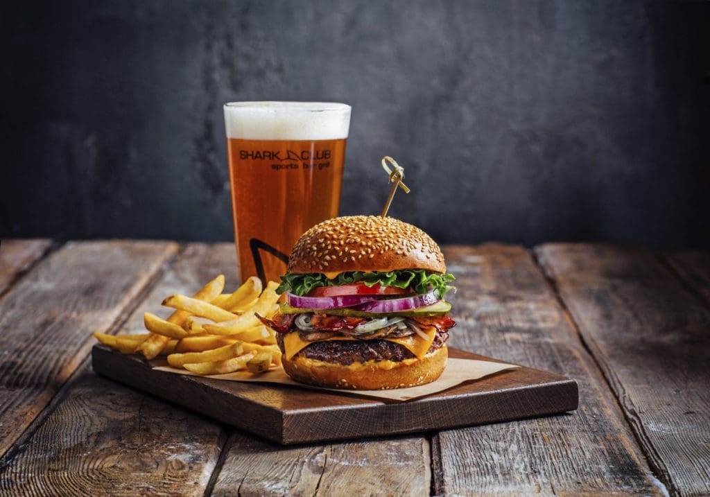 The sports restaurant and bar serves burgers and beer.
