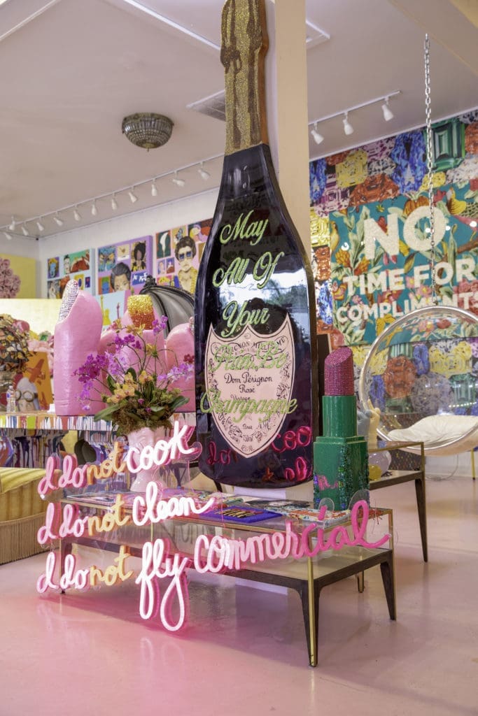 Longshore's bottle of Veuve is her calling card, and here it sits behind a piece that states, "I Do Not Cook, I Do Not Clean, I Do Not Fly Commercial," which is also the name of her upcoming coffee table tome published by Rizzoli.