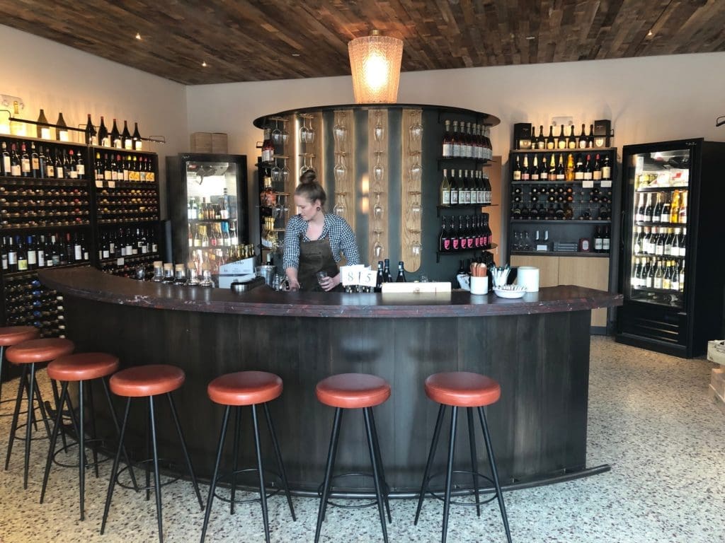 Bar stools provide casual seating in Montrose Cheese & Wine. (Photo by Shelby Hodge)