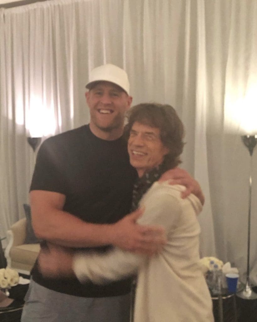J.J. Watt and Mick Jagger shared a backstage hug at the Rolling Stones' Houston concert. (@jjwatt)