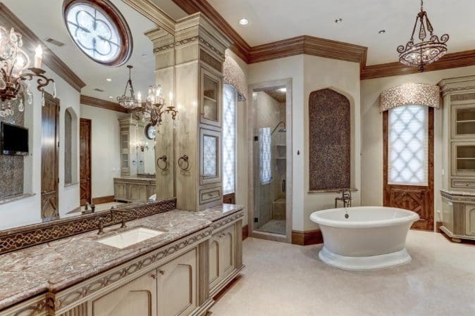 When the design is English Tudor as in this home by Tanglewood Builders, the master bath reflects a more traditional look.
