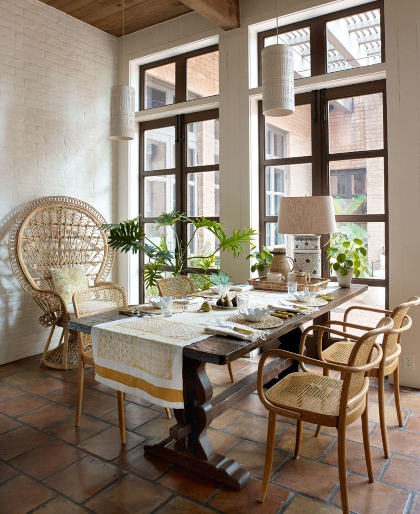 In the breakfast area of the Colburn-designed Houston home, Tom Scheerer painted the original ceramic light fixtures white.  (Photo by Francesco Lagnese)