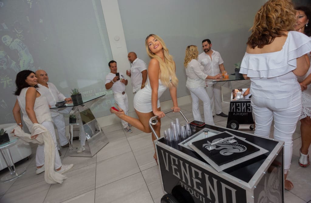 Bar cart girls add extra sizzle to the Texans/tequila bash. (David Duncan Photography for Veneno Tequila)