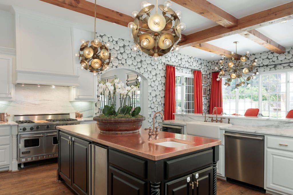 The kitchen is soft with exposed wooden beams. 