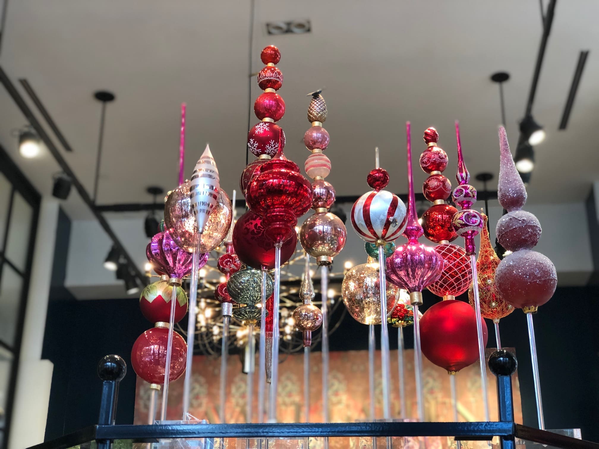 Avant Garden artists develop an ingenious use for Christmas tree spindles, secure them atop acrylic posts and bases for table decorations. (Photo by Shelby Hodge)