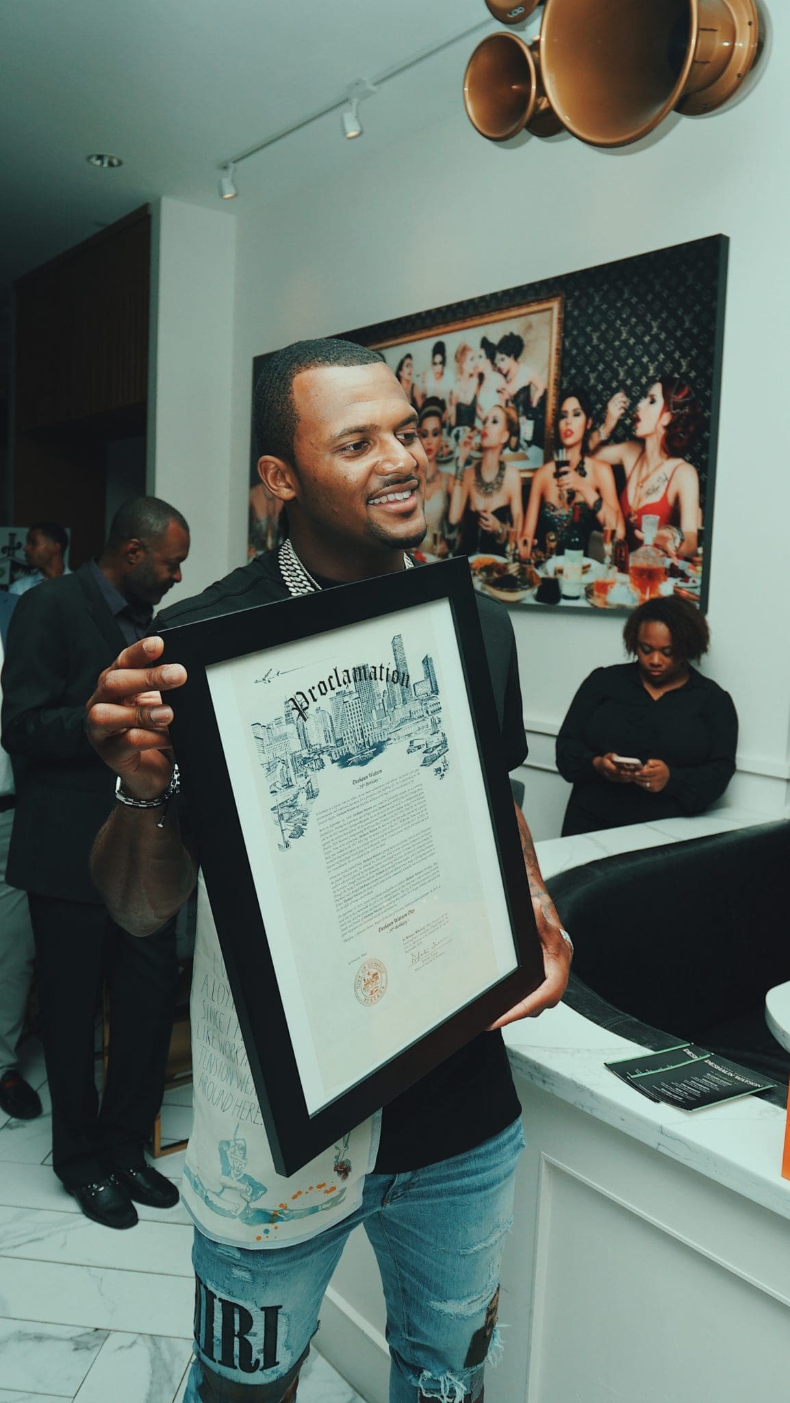 Houston Texans quarterback DeShaun Watson shows off his Mayoral Proclamation declaring it DeShaun Watson day in Houston.