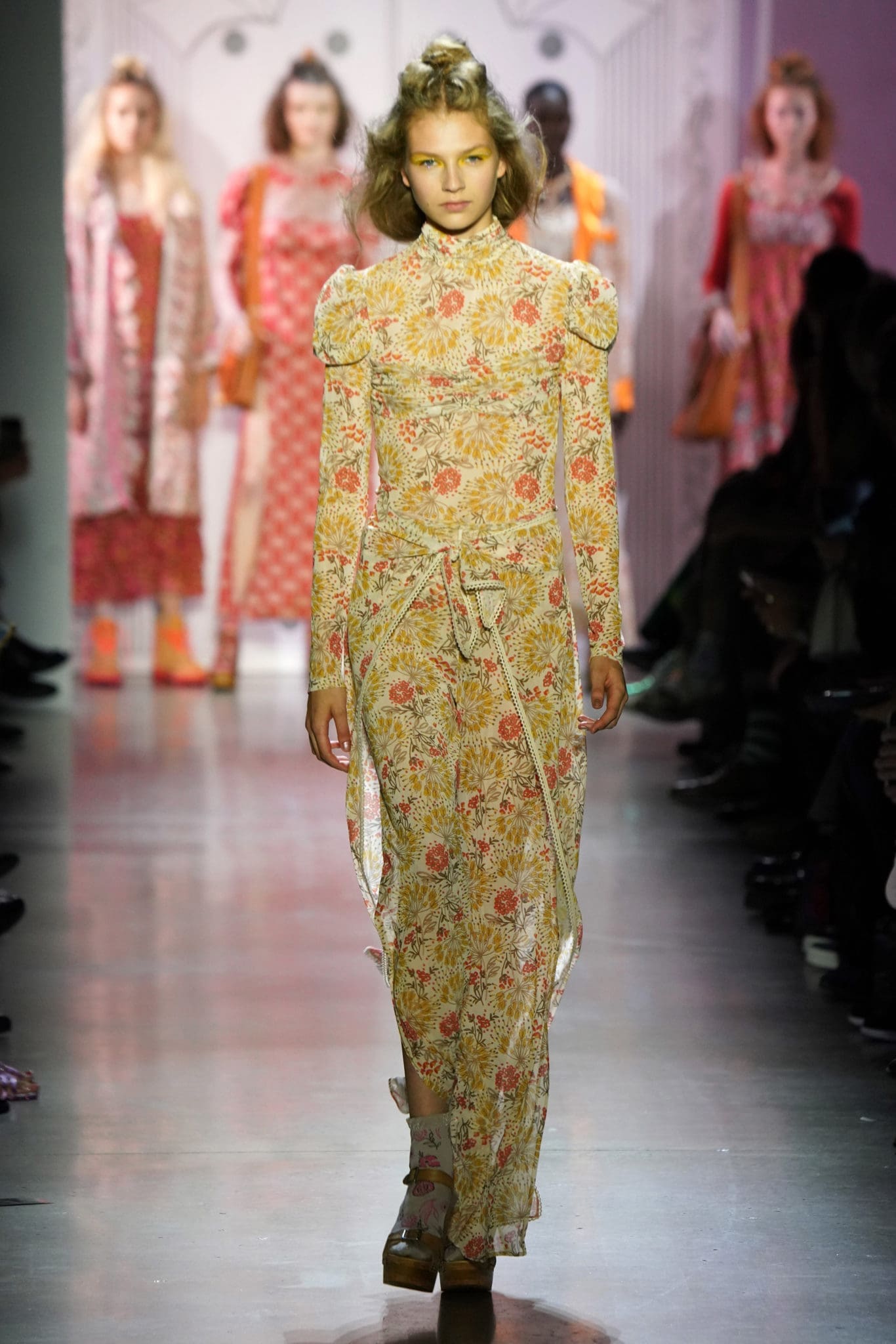 Anna Sui led off her spring 2020 collection with a coral long-sleeve multi-firework mesh top and pants. (Photo by Thomas Lau courtesy of Anna Sui Design Studio)