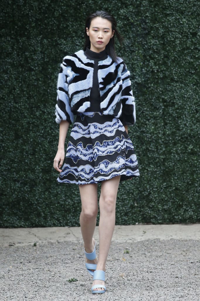 Burnett New York black high neck top with black multi-wave skirt and crop fur jacket. (Photo courtesy of Burnett New York)