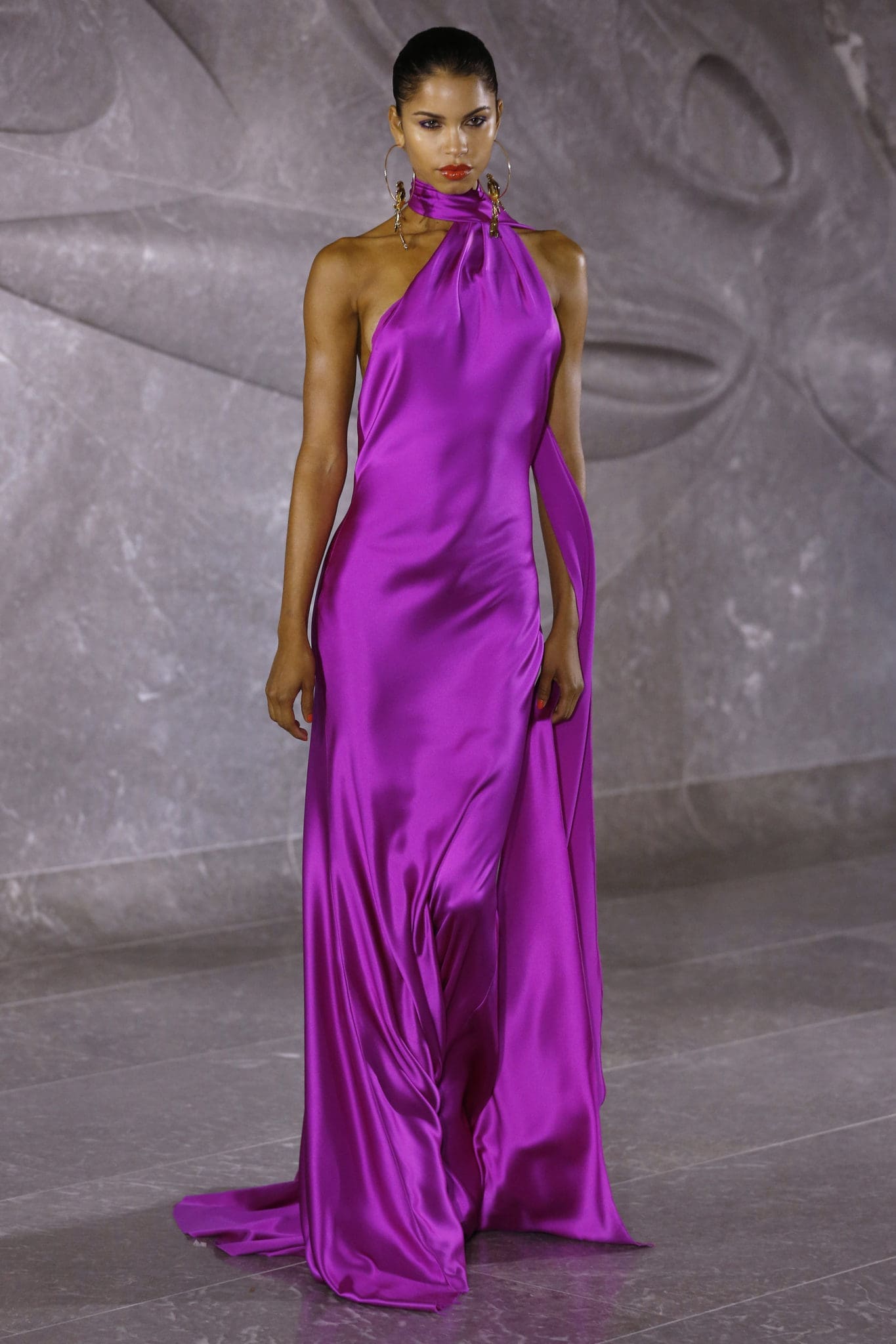 Naeem Khan one shoulder fuchsia gown with scarf detail. (Photo by Dan Lecca)