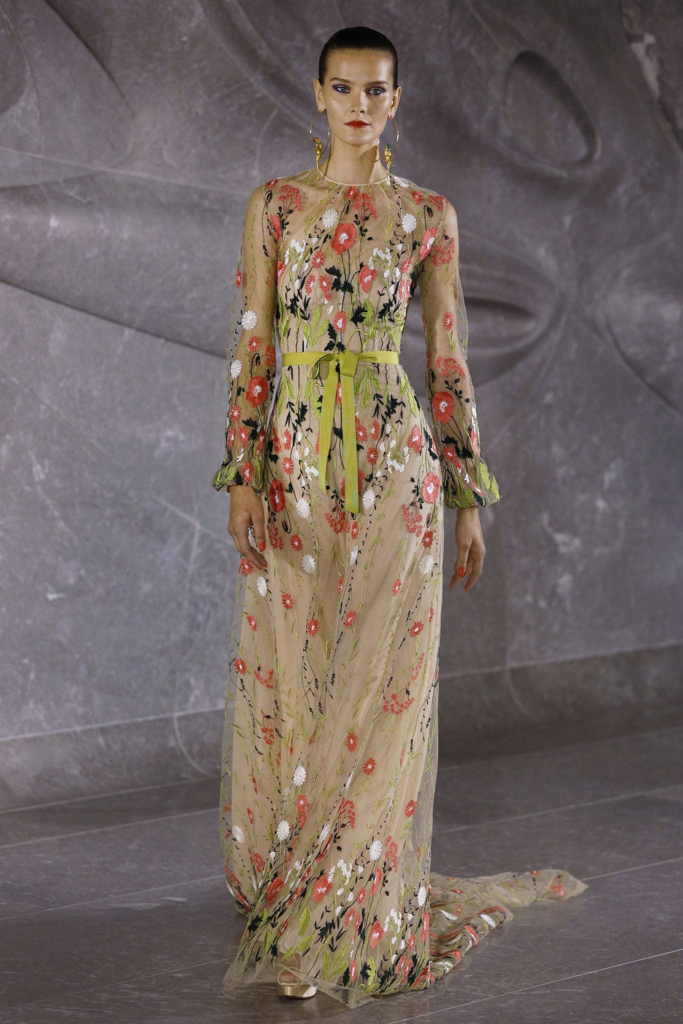 Naeem Khan red and white floral embroidered gown with blouson sleeves and belt detail. (Photo by Dan Lecca)